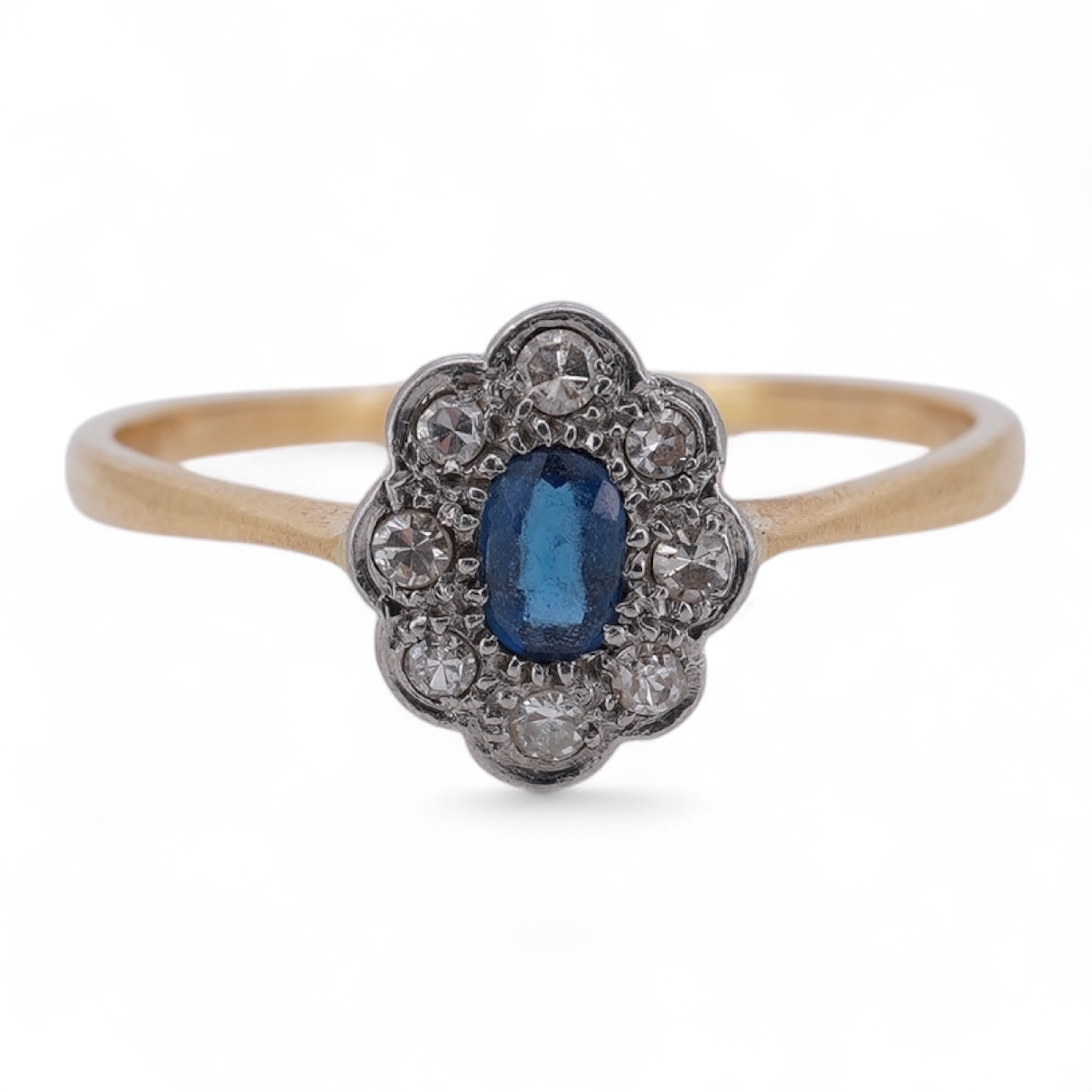 A 1920's yellow metal, stamped 18ct, sapphire and diamond set oval cluster ring, size V, gross weight 2.3 grams. Condition - poor to fair